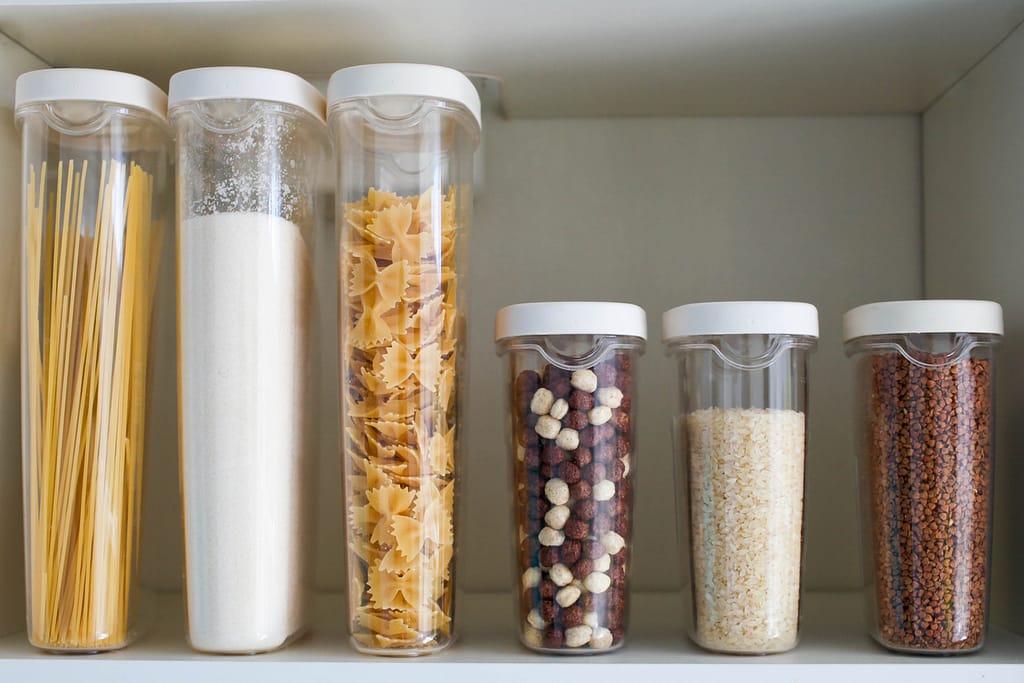 containers of grains and nuts - healthy pantry staples
