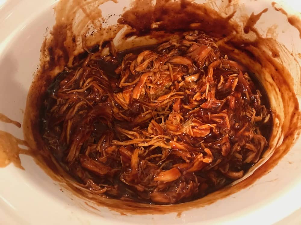shredded chicken covered in BBQ sauce