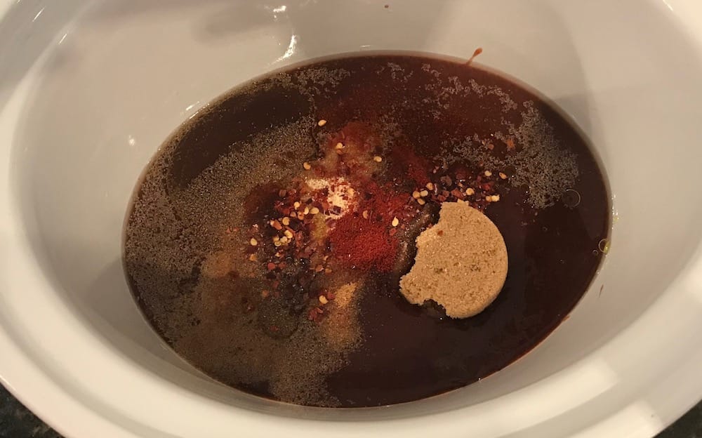 ingredients thrown together in crock pot slow cooker 