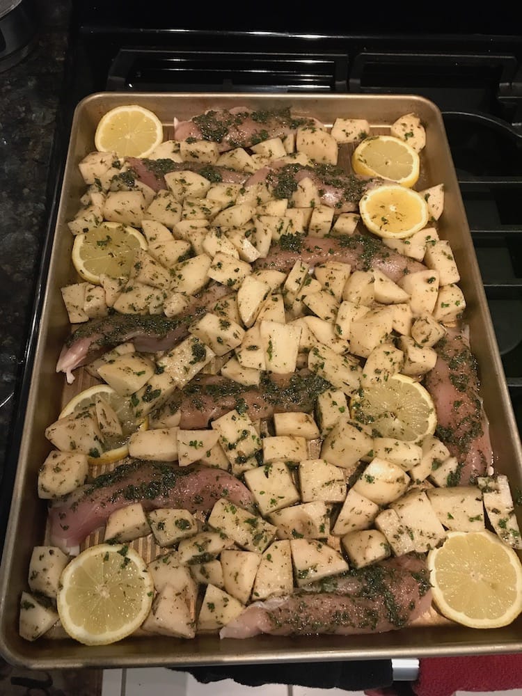 Greek chicken and potatoes before baking